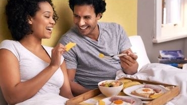 Woman and Man eading in bed